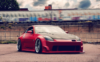 Red sports car train track - a train track free wallpaper