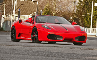 Red sports car driving street 3 - a house and trees free wallpaper