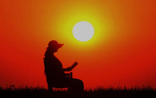 Woman sitting reading sunset silhouette - elizabeth durack free wallpaper