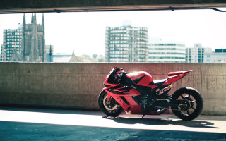 Red motorcycle cityscape tiltshift photorealism - a red motorcycle free wallpaper