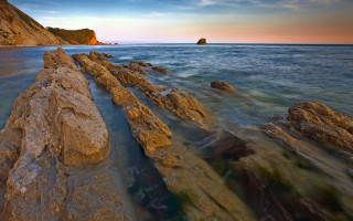 Rock wall ocean sunset boat - sunset free wallpaper