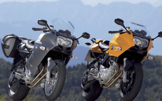 Motorcycles grass trees mountains outdoor - the background in the distance free wallpaper