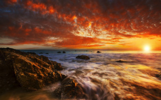Sunset ocean rock foreground saturated - a sunset over the ocean free wallpaper