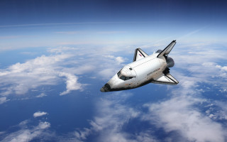 Space shuttle clouds water sunset - a space shuttle free wallpaper