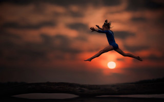 Woman jumping sunset tree microscopic - a microscopic photo free wallpaper