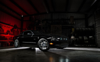 Black car garage red lights - side and a man free wallpaper