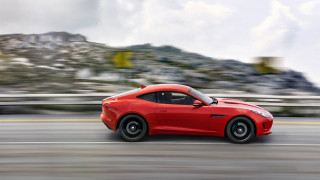 Red sports car driving mountain - a road near a mountain range free wallpaper