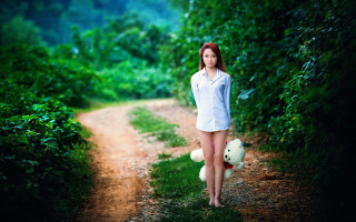 Woman teddy bear forest outdoors - a forest in the background free wallpaper