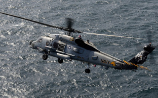 Helicopter ocean person watercraft waves - a helicopter free wallpaper
