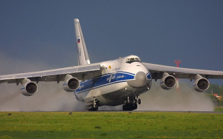 Jetliner takeoff smoke engine landinggear - an airport runway free wallpaper