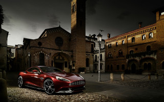 Red sports car clocktower night - a clock tower in the background free wallpaper