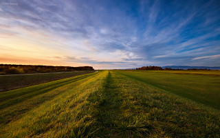 Field road clouds mountains beach - a matte painting free wallpaper for desktop