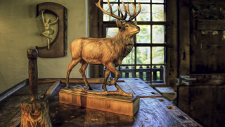 Wooden deer sculpture arts and - a table in a room free wallpaper