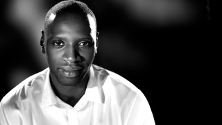Serious man white shirt bald - his face and shoulders free wallpaper