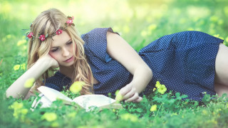 Girl blonde reading flower garden - her hair and a flower free wallpaper