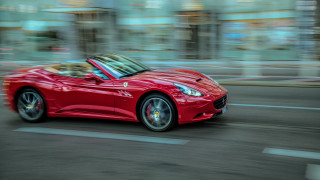 Red sports car clock building - a tall building free wallpaper
