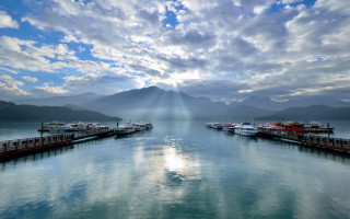 Lake mountains pier boat sky - crepuscular ray free wallpaper