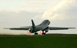 Jet plane takeoff smoke wings - gear free wallpaper