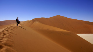 Man dog desert mountains sand - sand free wallpaper