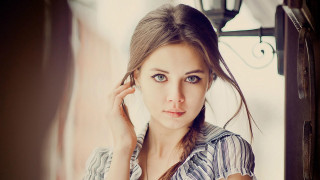 Woman blue shirt raising ear - elina karimova free wallpaper