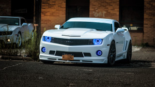 White car blue lights brick - a brick building free wallpaper