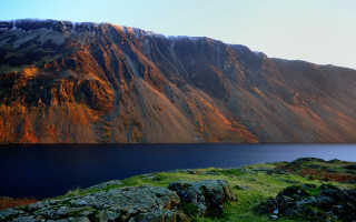 Mountain lake grass rock outcrop - a lake in the foreground free wallpaper