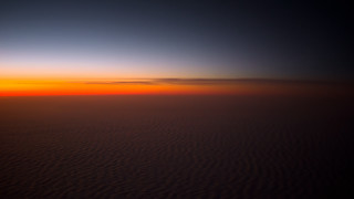 Sunset plane wing dim lighting - a dark sky in the background free wallpaper