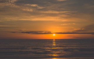 Sunset ocean boat beach lights - the beach in the distance free wallpaper