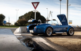 Blue sports car hood open 2 - a street sign free wallpaper