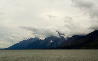 Boat mountains clouds sky ocean - free ship wallpaper