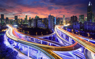 City skyline highway bridge night 2 - a city skyline in the background free wallpaper