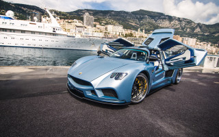 Blue sports car harbor cityscape - a city in the background free wallpaper