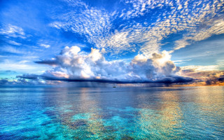 Beautiful blue ocean clouds sunny - the water below free wallpaper