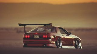 Red car surfboard parking lot - roof free wallpaper