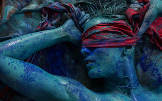 Blue paint woman underwater photorealistic - her hand behind her head free wallpaper