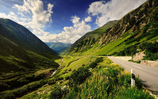Scenic valley road mountains clouds - a scenic view of a valley free wallpaper