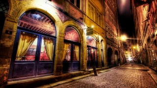 Cobblestone street arch window cityscape - brassaï free wallpaper