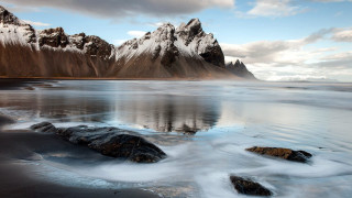 Mountain range reflection lake rocks 2 - the shore free wallpaper