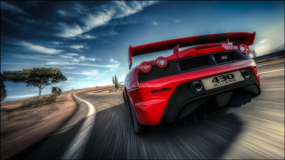 Red sports car cloudy sky 11 - a sky background and trees free wallpaper