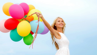 Woman balloons smiling blue sky - a woman holding free wallpaper