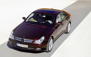 Maroon car driving white wall - constant permeke free wallpaper