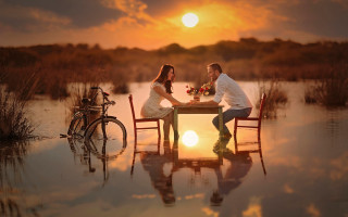 Couple water bike sunset mountains - a bike in the background free wallpaper