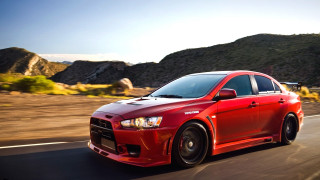 Red car mountain road sky - redshift free wallpaper