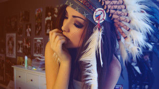 Woman feather headdress leaning dresser - chica macnab free wallpaper