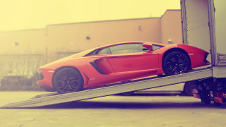 Red sports car trailer street - a trailer free wallpaper