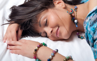 Woman smiling beaded bracelet bed - a bracelet free wallpaper