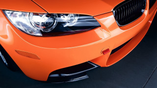 Bright orange car headlights grills - a close up free wallpaper