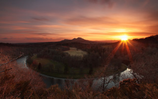 Sunset river forested horizon mountain - a grassy area free wallpaper