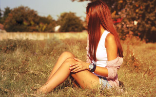 Woman sitting field autumn redhair - a photo free wallpaper