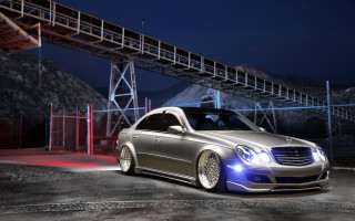 Silver car parked night bridge - a bridge in the background free wallpaper